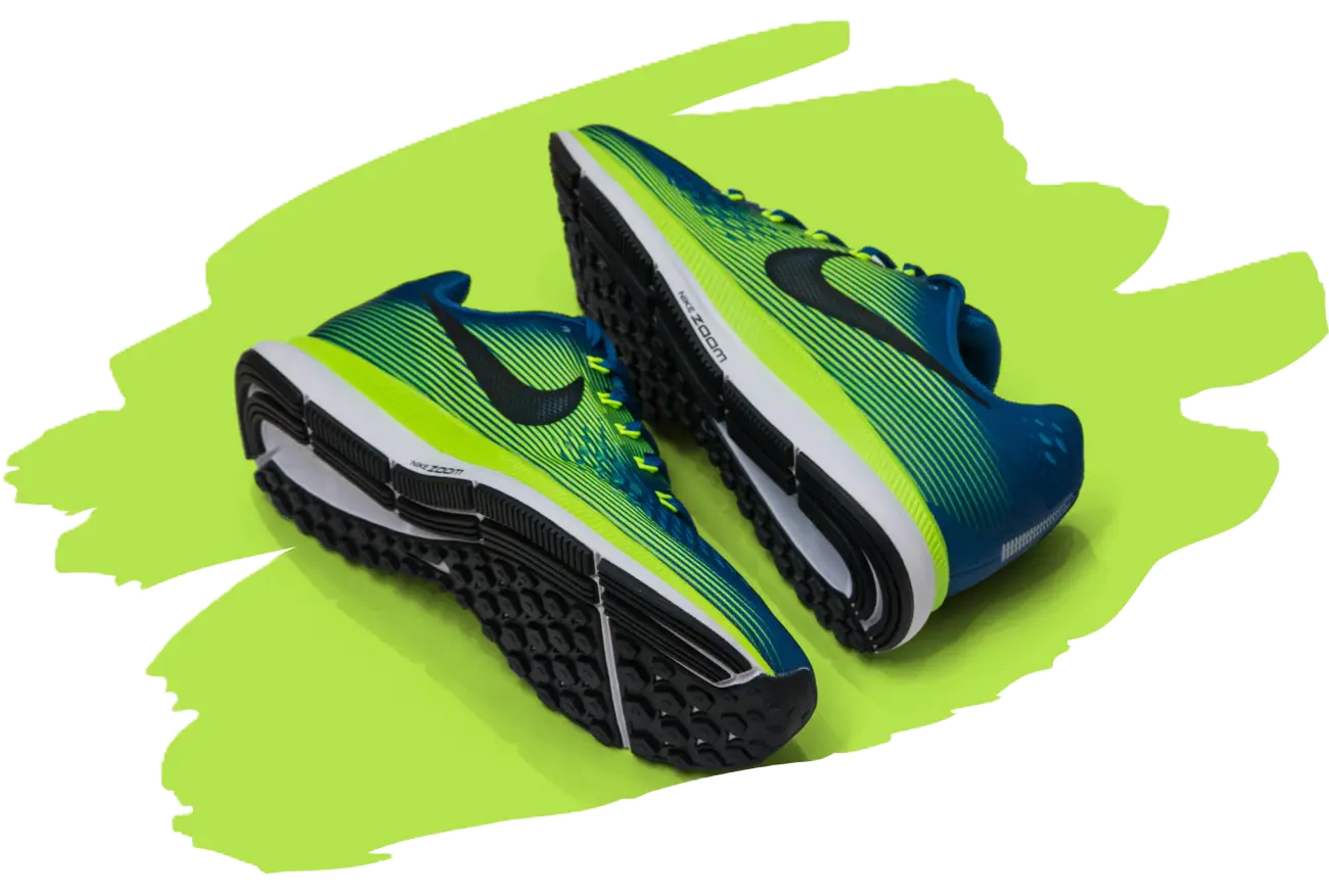 Pair of blue and green Nike running shoes